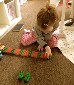 Doing a sequence with duplo bricks.